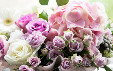 Beautiful flowers in a white round box