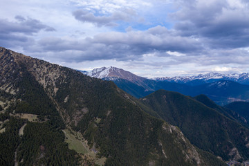 Aerial drone view of mountains in Andorra with snow on top