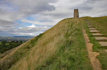 Fototapeta na wymiar Approaching St Michael's church tower which stands on the top of Glastonbury Tor in Somerset, United Kingdom