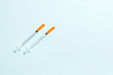 Top view of insulin syringes ready for injection on colorful background. Diabetic concept with copy...
