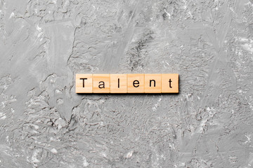 Talent word written on wood block. Talent text on cement table for your desing, concept