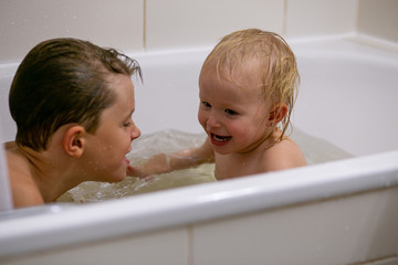 horizontal photo of happy kids fooling around in the bathroom