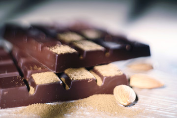 Chocolate with nuts close-up narrow zone of sharpness