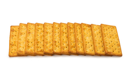 Cracker with salt isolated on white.