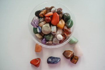 multi-colored pebbles on a white background