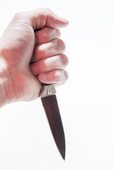 Knife in a man's hand on a white background
