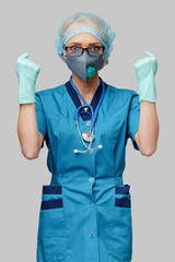 female doctor with stethoscope wearing protective mask and latex gloves over light grey background