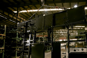 Naklejka na ściany i meble Large steel plates hang inside the heavy-duty factory