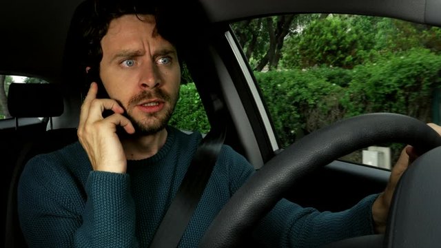 Angry man talking on the phone driving car stressed out by financial problems after quarantine corona virus