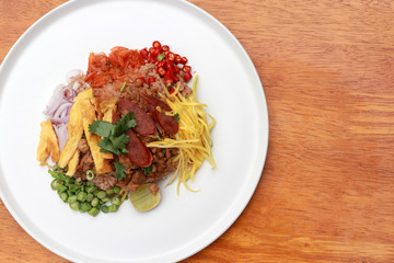 Shrimp Paste Rice Salad in the white round plate.