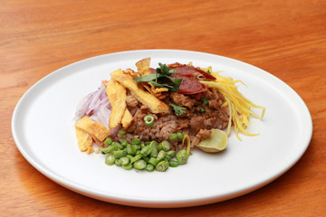 Shrimp Paste Rice Salad in the white round plate.