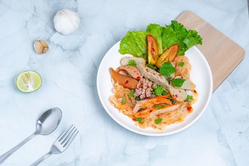 yam wun sen, Glass noodle spicy salad with Thai pork sausage ,mix vegetables,mushrooms, carrots,onions,minced pork and chilly in Thailand it call “Yam moo yo” Popular and famous food in Thai.