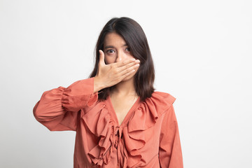 Young Asian woman close her mouth with hand .