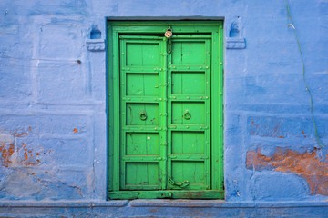 India, Jodhpur,.incredible carved windows and doors on the streets of the blue city in Rajasthan. scenic street life of colorful india