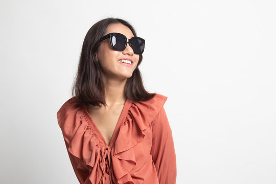 Portrait Of A Beautiful Young Asian Girl In Sunglasses .