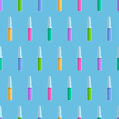 Obraz premium Seamless pattern from ampoules with colored liquid inside