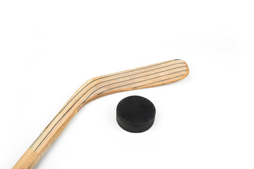 Ice hockey stick and puck on a white
