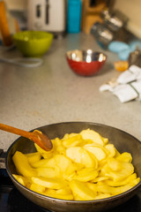 wok with apple slices cooked for pie