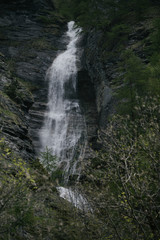 Waterfall in the alpine mountains.