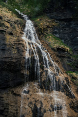 Waterfall in the alpine mountains.