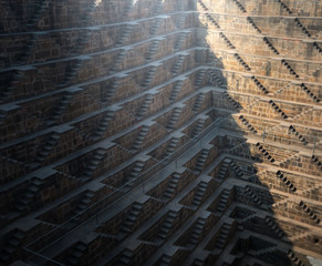 .Perspective background of stone stairs of Chand Baori Step Well in Abhaneri, Rajasthan, India. Stepwells in which the water is reached by descending a set of steps to the water level