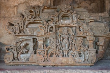 .Broken sculpture of God and Goddess carved in stone by ancient Hindu craftsmen at the Chand Baori Step Well in Abhaneri, Rajasthan, India.