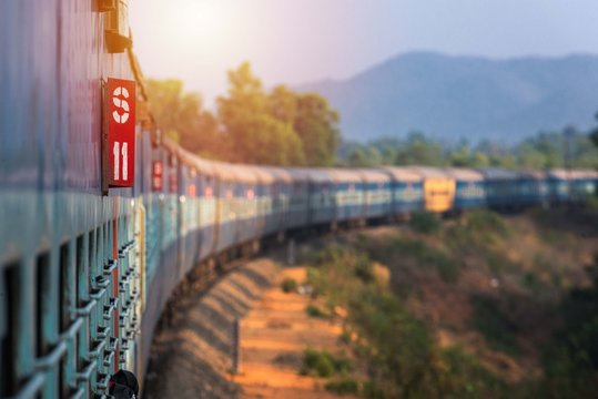 India, Maharashtra, Perspective view and curve of Indian train at the dawn. Indian trains are the cheapest way to travel around India