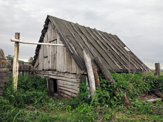 A dilapidated abandoned barn in the village.