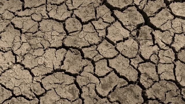 Drought cracked soils, dry crack lakes, drought soil at the bottom of the river. Ecosystems caused by climate change. Drought concept. thirst and desertification. tilting top view. top angle  top view