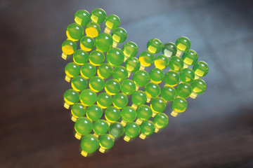 group of hydrogel balls in the shape of heart on a glass