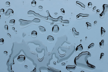 group of water drops on a glass surface