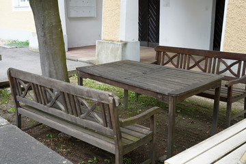 Benches and chairs at tables invite you to relax and unwind
