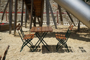Benches and chairs at tables invite you to relax and unwind