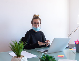 Young businesswoman working with mask.