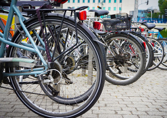 Fototapeta na wymiar wheel of bicycle on a background bicycles