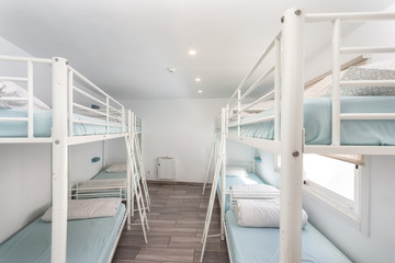 Clean bedroom with bunk beds in a hotel, a hostel for tourists.