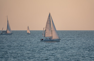 Fototapeta premium Sailing yachts in the blue calm sea.