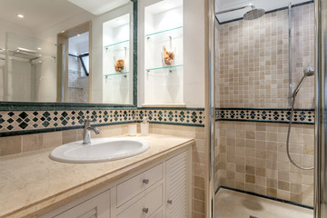 Modern bathroom with shower and mirror. European hotel design.
