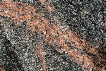 background texture of red and black granite close-up. pattern for design