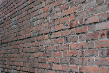 Angled view of the red brutal brick wall texture abstract industrial background