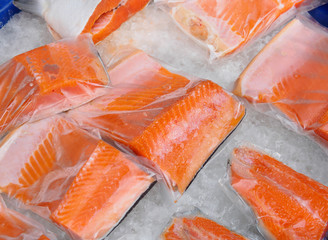 Fresh salmon fillet in plastic packing for sell in supermarket or seafood market. Healthy food. - 353442247