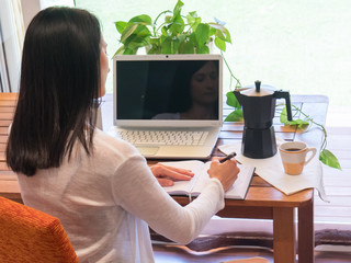 Young Woman Working At Home in a Relaxed Atmosphere.