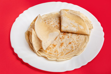 Tasty pancakes on Shrovetide on background