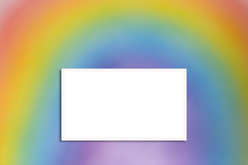 Blurred rainbow background with white frame, place for text.