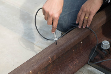 Engineer inspection on railway power supply equipment with electrical measurement tools