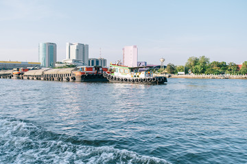 Bangkok, Thailand - 22 may, 2020 : tug boat taking out sand carrier on the Chao Phraya River. Sand...