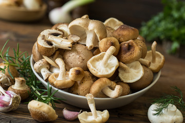 Fresh mixed mushrooms on the wooden table