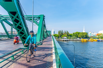 Bangkok, Thailand - 22 may, 2020 : Cyclists on the Phra Phuttha Yodfa bridge.