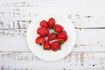 red strawberries on a white plate