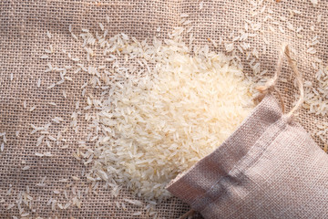 Rice in a bag on table cloth, Top view.